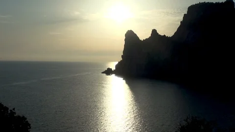 View from Galitsyn trail on pebble in calm sea at sunset. Stock Footage 107133004