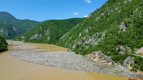 View of the garbage floating on the Drina river in Bosnia and Herzegovina Stock Footage 265157224