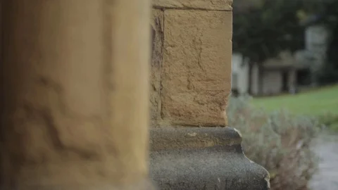 View of garden through stone pillars in English church Vídeos de archivo 123817183