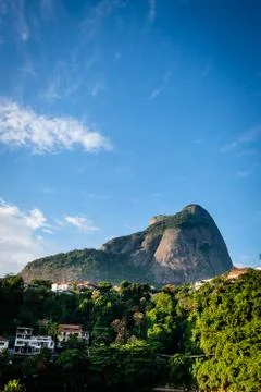 View of the Gavea Stone, seen from below with houses on the hill during late  Stock Photos