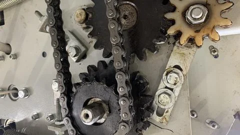 View of gears and chains on the engine machine Stock Photos