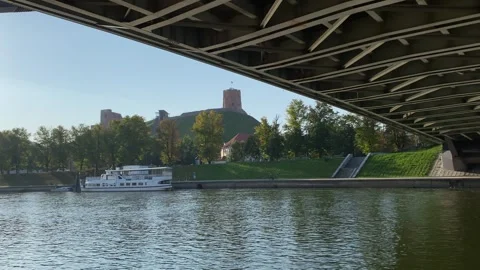 View of Gediminas Tower from under bridge over Neris river in Vilnius, Lithuania Stock Footage 250408330