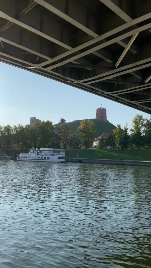 View of Gediminas Tower from under bridge over Neris river in Vilnius. Vertical Stock Footage 250408344