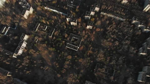 View of ghost city of Pripyat with Chernobyl nuclear power plant and sarcophagus Stock Footage 159265489