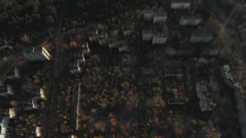 View of ghost city of Pripyat with Chernobyl nuclear power plant and sarcophagus Stock Footage 159265595