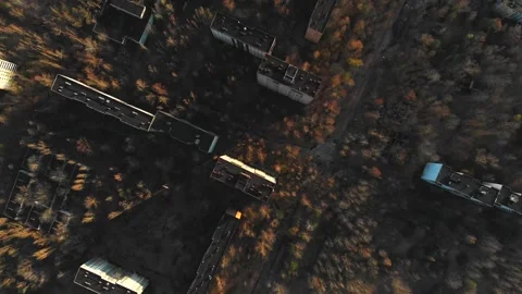 View of ghost city of Pripyat with Chernobyl nuclear power plant and sarcophagus Stock Footage 159265717