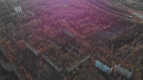 View of ghost city of Pripyat with Chernobyl nuclear power plant and sarcophagus Stock Footage 159265785