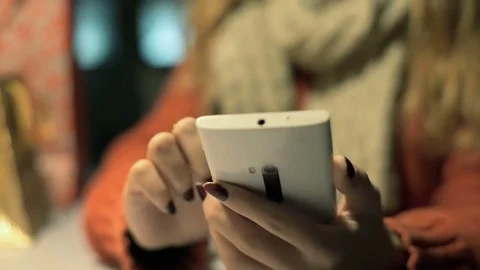 View of girl's hands touching screen on smartphone while browsing internet Stock-Footage 70573729