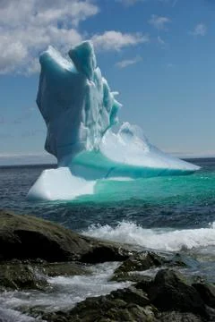 View of a glacier floating in the ocean Stock Photos