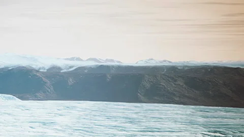View of glacier landscape in a cool region with mountains in the background Stock Footage 340024929