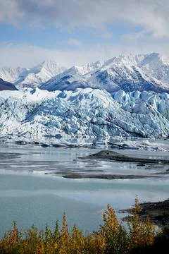 A view of a glacier with mountains Stock Photos