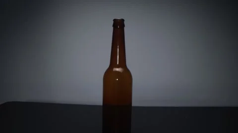 View of a glass bottle on a dark background 動画素材 167789003
