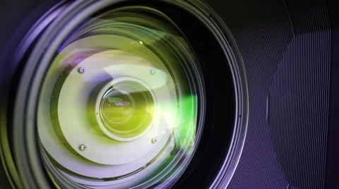 View of the glass elements in a camera lens. Objective under yellow light. Tilt Video stock 68151764