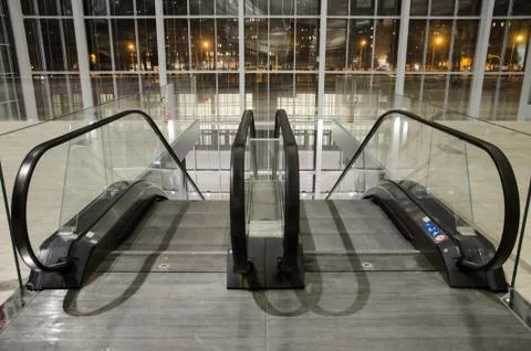 View of the glass window from the escalators and night view. Stock Photos