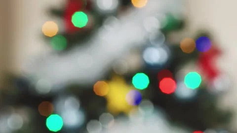 View of glowing Christmas tree lights in vibrant colors Stock Footage 303072090