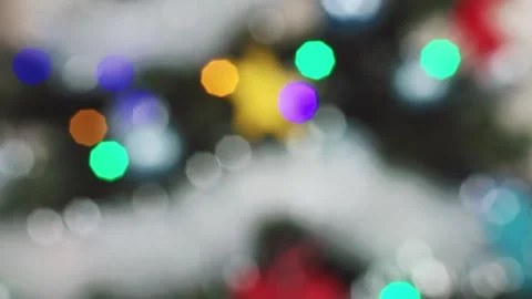 View of glowing Christmas tree lights in vibrant colors Stock Footage 303072162