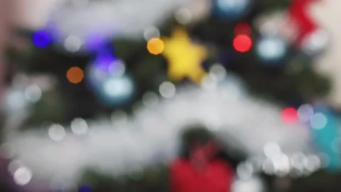 View of glowing Christmas tree lights in vibrant colors Stock Footage 303072173