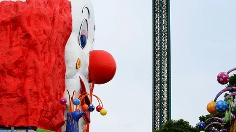 View goes from clown up a tower to carousel, Prater in Vienna 스톡 동영상 109391053