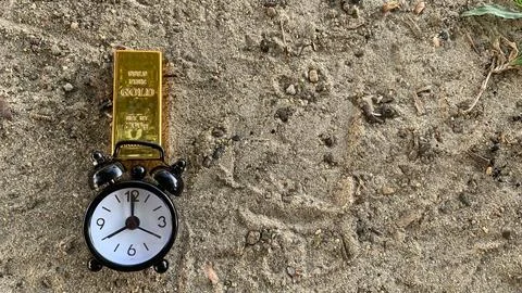 View of gold bar and clock, suitable for  financial planning Stock Photos