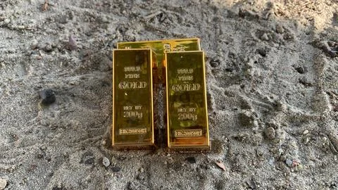 View of gold bars and sandy soil background, Stock Photos