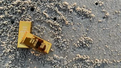 View of gold bars and sandy soil background, Stock Photos