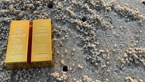 View of gold bars and sandy soil background, Stock Photos
