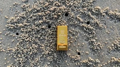 View of gold bars and sandy soil background, Stock Photos