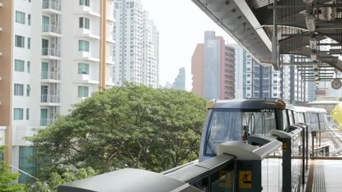 View on the Golden Line BTS skytrain platform while automated skytrain appr.. Stock Footage 276353114