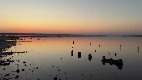View of Golden Sunset Reflection over Salt Estuary Stock-Footage 342131445