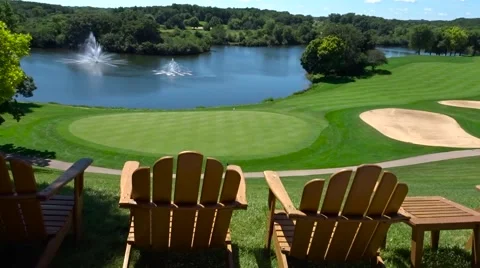 View of Golf Course with Adirondack Chairs Stock Footage 53454573
