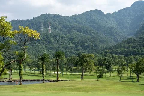View of Golf course with mountain range in the back Stock Photos