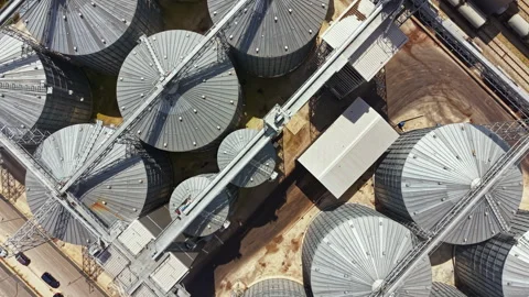 View of grain silos and storage facilities from above on a farm in a rural area Video stock 341385039
