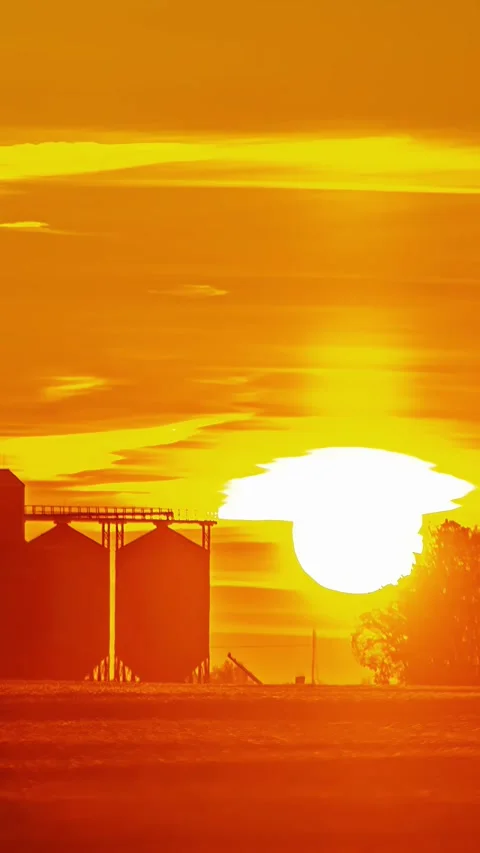View of grain silos at sunset in Latvia. Stockbeeldmateriaal 339900807