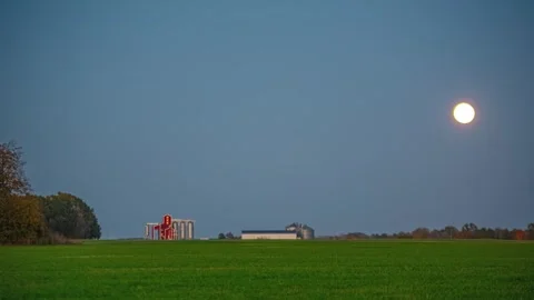 View of grain silos under the full moon in Latvia. 库存影片 340637975