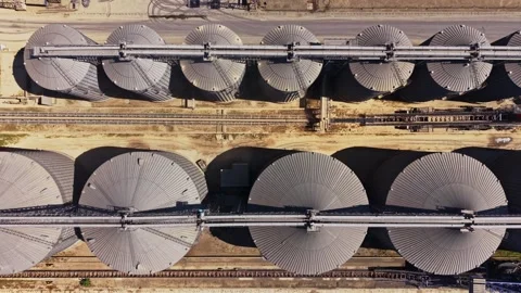View of grain storage silos on a farm in a rural area during daytime Stock Footage 338404506