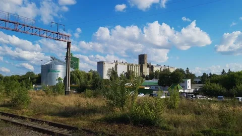 View to the granary from open window of quickly driving train. Stock Footage 161533298