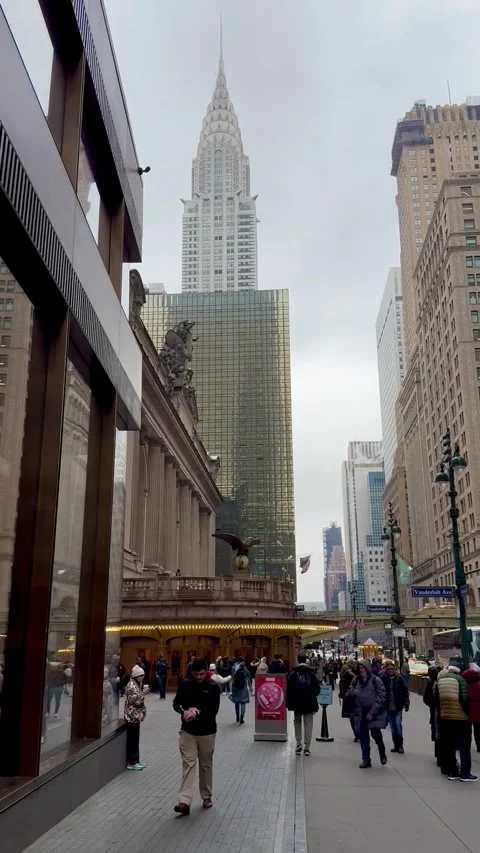 View of Grand Central Terminal and Chrysler Building while walking on 42nd St Stock Footage 322019280