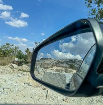 View of granite quarry mine with massive stone blocks through the rear glas.. Stock Photos