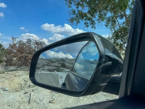 View of granite quarry mine with massive stone blocks through the rear glas.. 库存照片