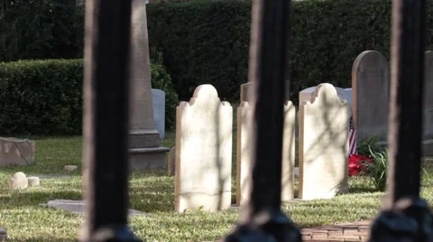 View of graves through fence posts Stock Footage 45533949