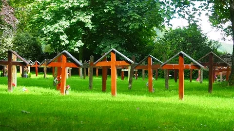 View of the graveyard of the Pluscarden Abbey, Scotland Stock Footage 79684839