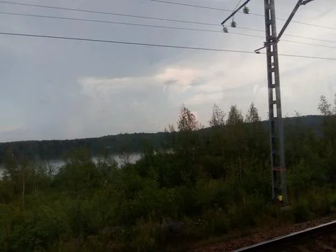 View of the gray sky from the train window Stock Photos