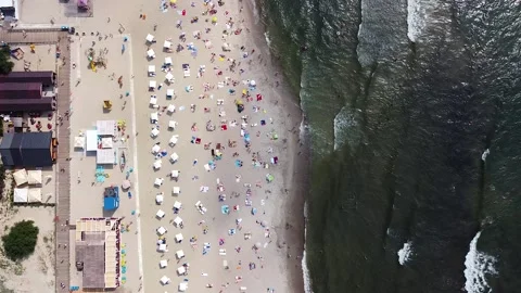 View from a great height of the sandy beach and many tourists on the shore Stock-Footage 178375117