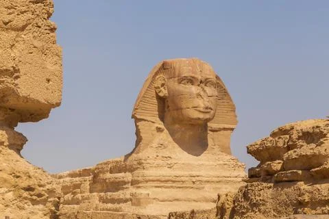 View on Great Sphinx through ancient stones nearby, Egypt Stock Photos