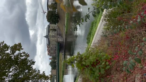 View on green bridge in Vilnius from Neris river bank in September. Vertical Stock Footage 211681361