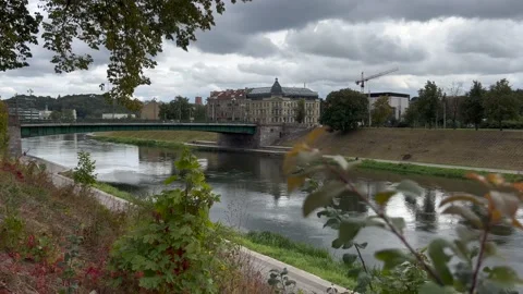 View on green bridge in Vilnius from Neris river bank in September Stock Footage 211681386