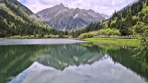 View of green-colored Dagu Lake during a summer morning Stock Footage 340704958