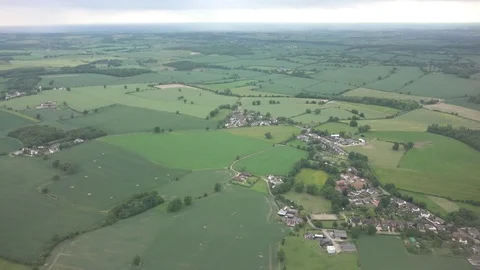 View of green landscape from airplane flight clouds formations rainy fall land Stock Footage 81985285