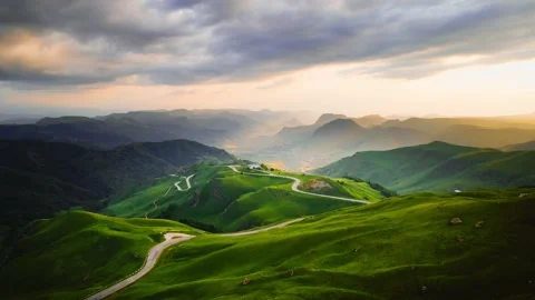 View of the green mountains and hills at sunset Stock Footage 232199093