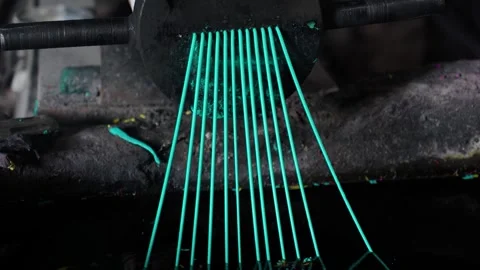 View of green plastic filaments being extruded, Bangladesh. Видео 336412056